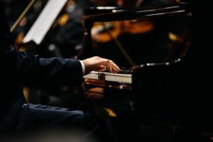 hands of pianist on keyboard
