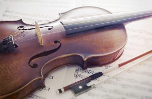 violin and bow on manuscript
