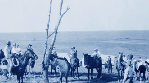 Old photo of men on horses