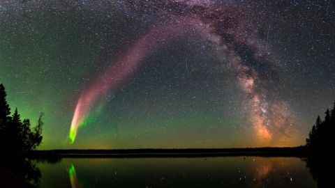 STEVE (Strong Thermal Emission Velocity Enhancement) and the Milky Way at Childs Lake, Manitoba, Canada. The picture is a composite of 11 images stitched together.