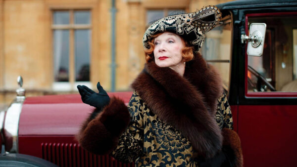 Shirley MacLaine wears an elegant coat with a fur trim in Downton Abbey season 3