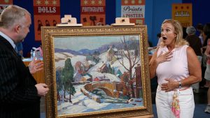 Alasdair Nichol appraises a Fern Isabel Coppedge oil painting, ca. 1925, in Orlando.
