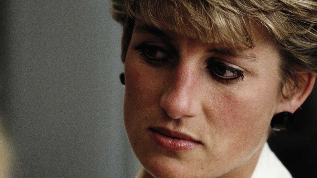 A closeup of Princess Diana looking pensive