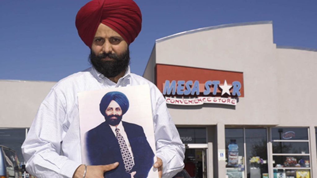 Rana Singh Sodhi holds a portrait of his brother, Balbir, a Sikh American who was murdered in the wake of 9/11
