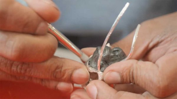 a hand crafted piece of jewelry in the making