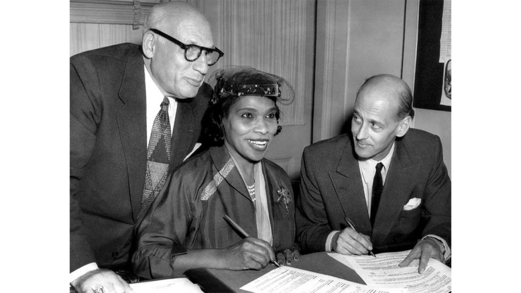 Singer Marian Anderson signs a contract