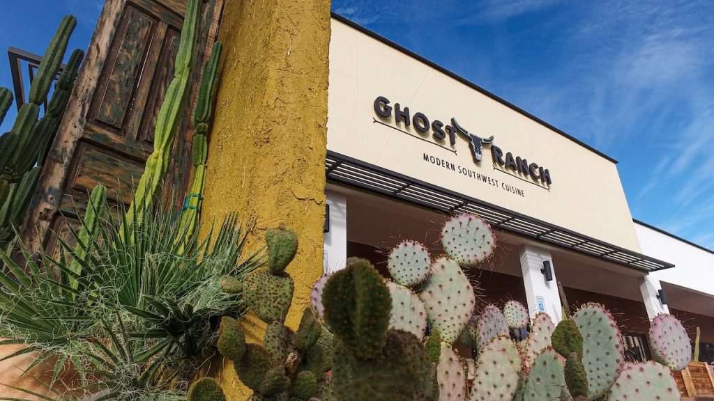 The exterior of the Ghost Ranch restaurant with cacti