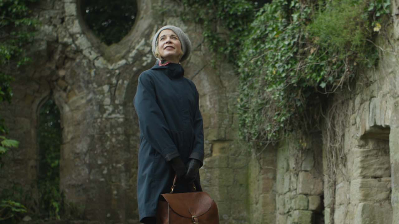 Lucy Worsley stands before the Nether Keith Chapel ruins
