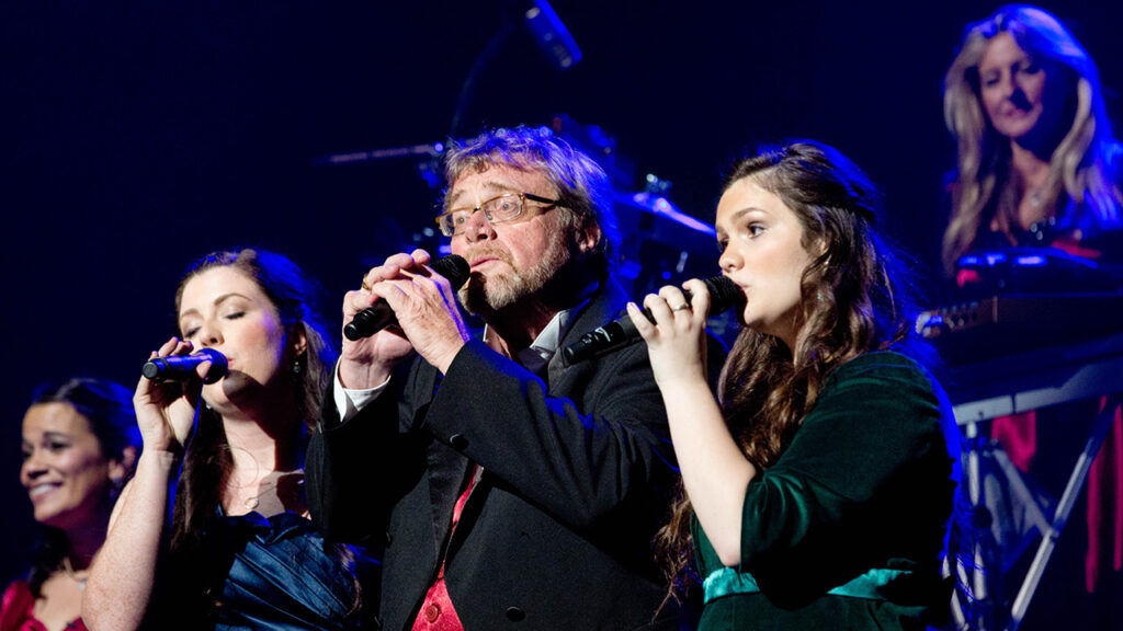 Chip Davis (center), founder of the multi platinum-selling group Mannheim Steamroller, and daughter Elyse Davis (right).