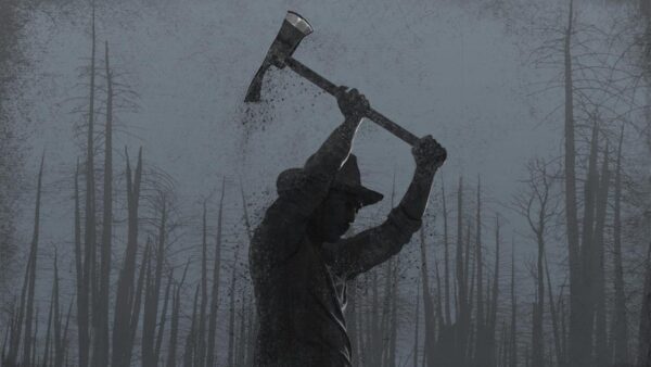 A firefighter, surrounded by leafless trees, raises an axe over his head