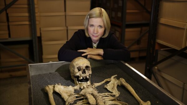 Photo shows Lucy with Black Death skeleton at the Museum of London.