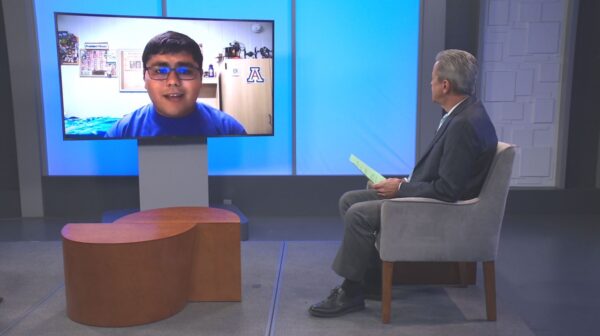 photo of young voter Isaiah Hinzman being interviewed by Ted Simons for Arizona Horizon