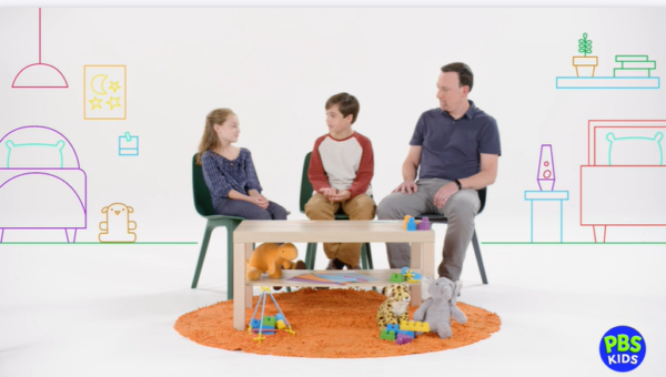 PBS Kids family talking together on the couch