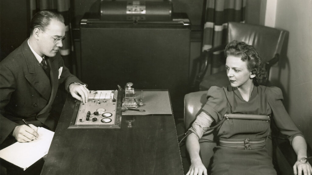 A lie detector being used on a female subject
