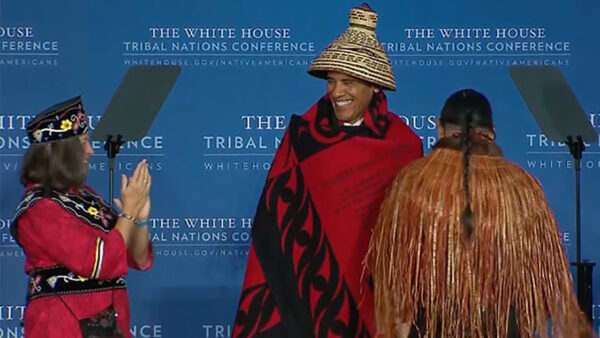 photo of former President Obama wearing a tribal hat