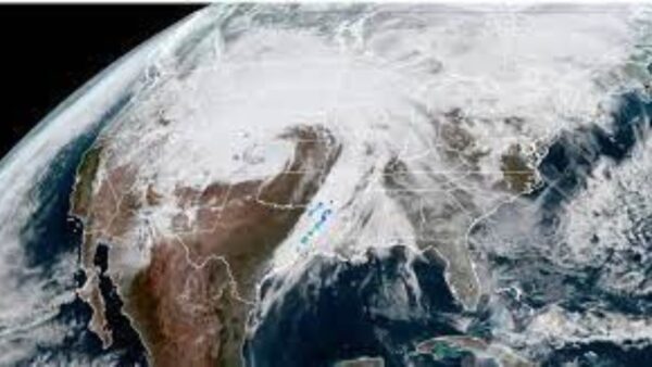 A satellite view of a map of the earth with clouds swirling into a Bomb Cyclone