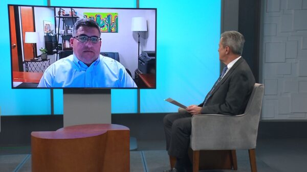 Economist Jay Spector speaking with Ted Simons over Video Call