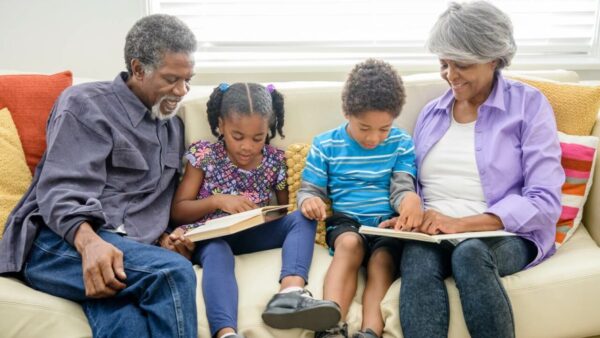 Grandparents read books to their grandchildren about Black History Month