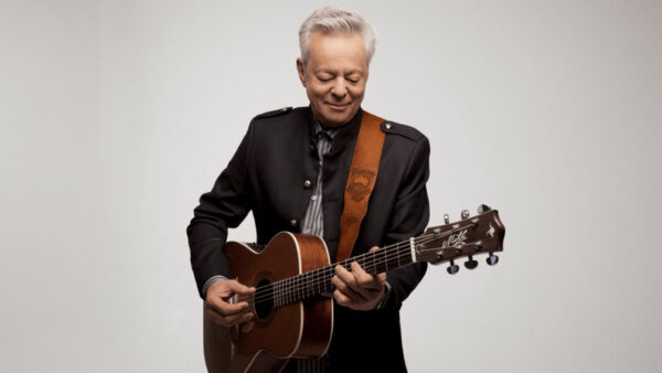 Tommy Emmanuel plays the guitar