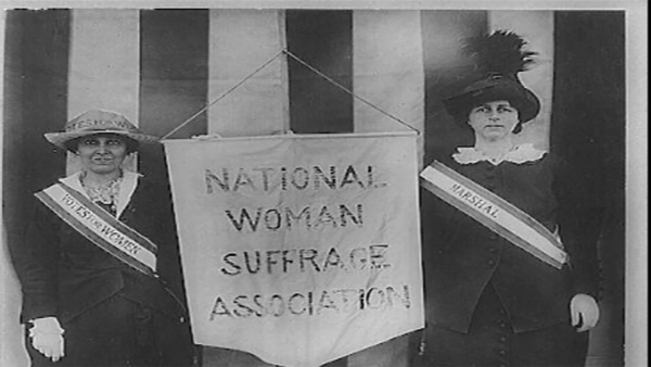 Women with banner that states 
