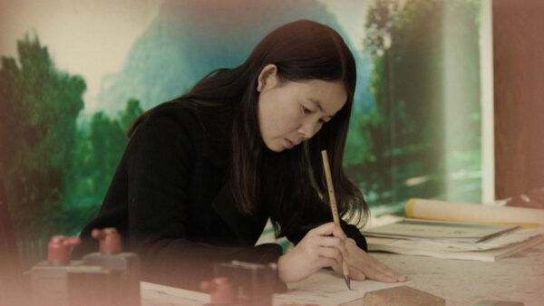 A Chinese woman practices the once-secret written language of Nüshu