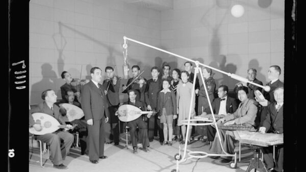 group of musicians in a recording studio
