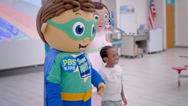 A student participates in a Super Why Reading Camp