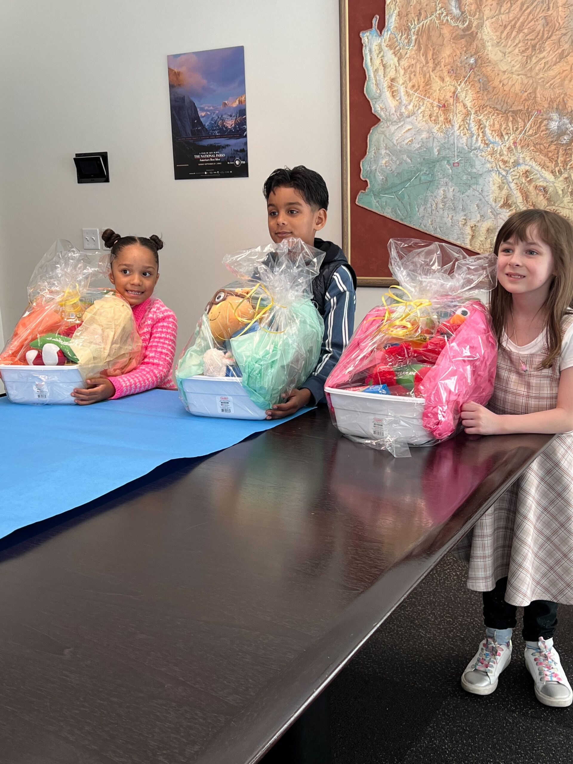 Children pose with prize baskets.