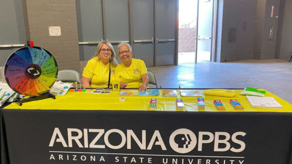 AZPBS Education team members pose for a photo at an AZPBS booth.