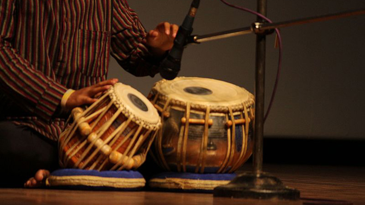 Drums being played in front of microphone