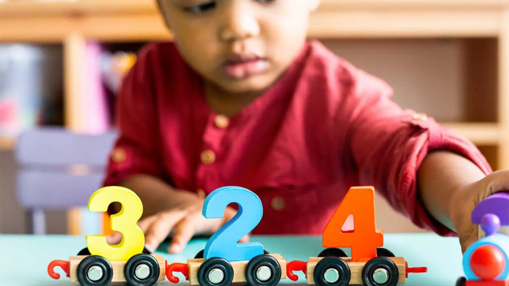 A child plays with number blocks.