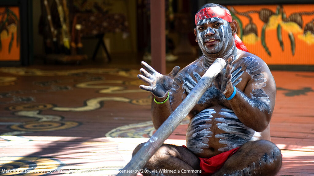 Aboriginal man playing didgeridoo