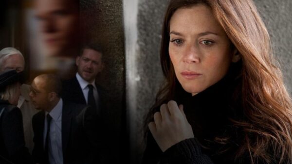A woman seems transfixed by doubt and suspicion after the death of her husband