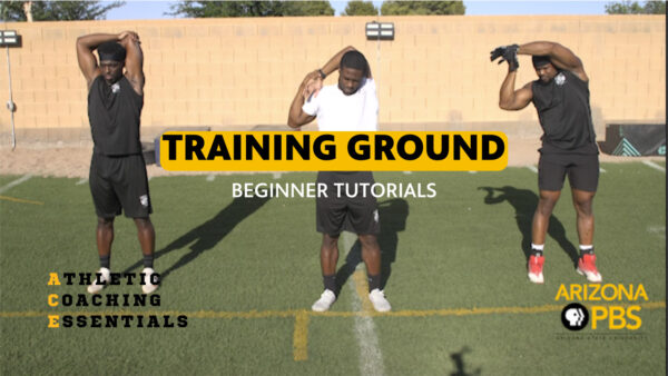 Three men stretching on a sports field as they teach and learn Sports Fundamentals