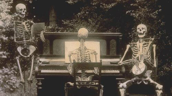 three skeletons playing instruments