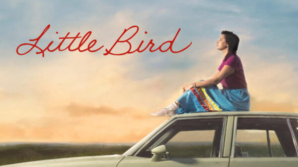 A young woman sits on top of a car as the sun sets, with the text: Little Bird