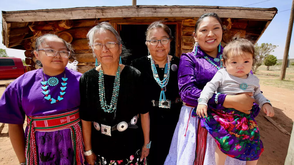 Several generations of Native American women in native dress