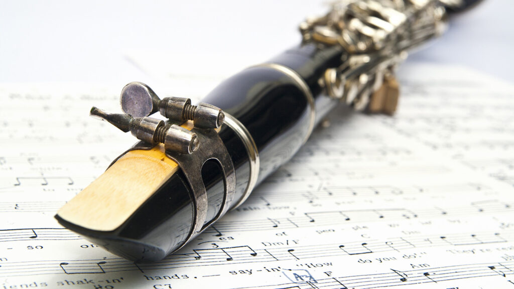 clarinet lying on sheet music