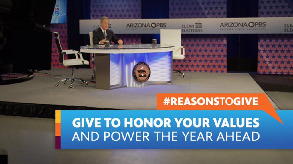 Ted Simons, host of Arizona Horizon, sits at a desk during a live taping of the Arizona Senate Debate