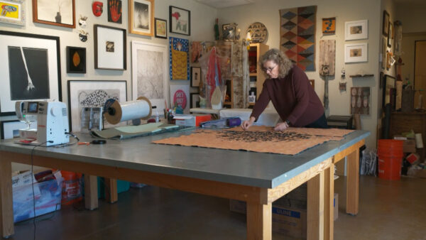 A woman working on a project in an art studio
