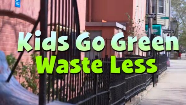 A view down an urban city street with text reading: kids go green waste less