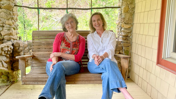 Barbara Kingsolver and Emily Ramshaw sitting on a swing