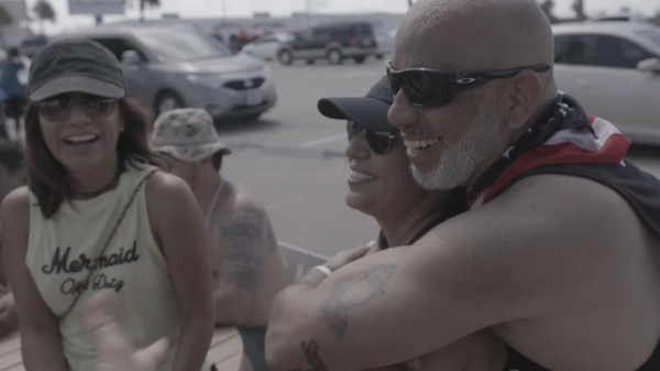 A group of people hugging and laughing