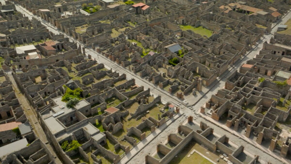 View of the ancient ruins of Pompeii, showing well-preserved streets and structures.