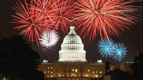 U.S. Capitol building with fireworks overhead