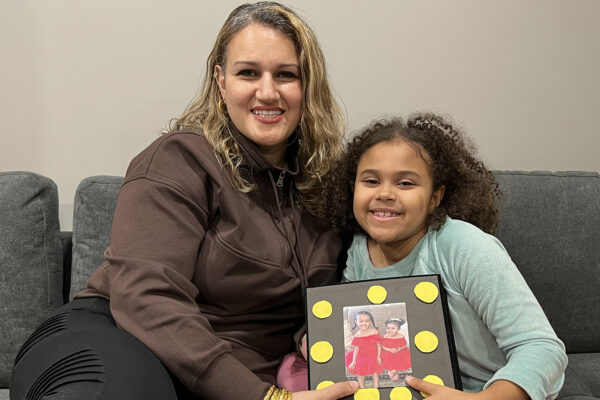 A mom and daughter with a family album