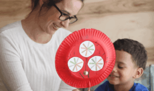 A mom and son with a chinese rattle drum