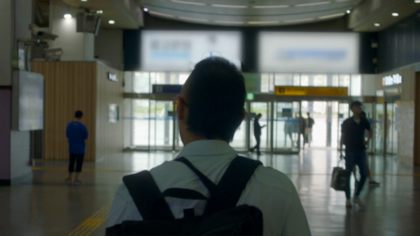 A man walking though an airport