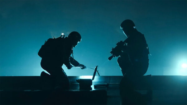 Two officers on top of a building