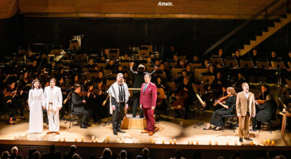 Singers and a band on stage